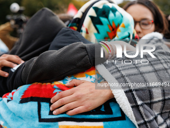 Indigenous demonstrators comfort one another near the U.S. Capitol in Washington, D.C. on October 15, 2024. after clashes with U.S. Park Pol...