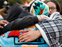 Indigenous demonstrators comfort one another near the U.S. Capitol in Washington, D.C. on October 15, 2024. after clashes with U.S. Park Pol...