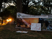 The sun sets behind an encampment erected by members of the Muwekma Ohlone Tribe of the San Francisco Bay Area, along with other tribal grou...