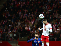 Josko Gvardiol of Croatia and Sebastian Szymanski during UEFA Nations League football match Poland - Croatia at National Stadium in Warsaw,...