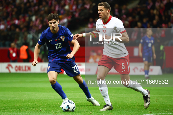 Igor Metanovic of Croatia and Jan Bednarek of Poland during UEFA Nations League football match Poland - Croatia at National Stadium in Warsa...