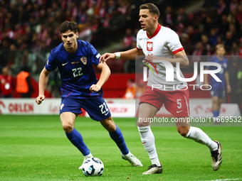 Igor Metanovic of Croatia and Jan Bednarek of Poland during UEFA Nations League football match Poland - Croatia at National Stadium in Warsa...