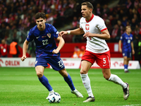 Igor Metanovic of Croatia and Jan Bednarek of Poland during UEFA Nations League football match Poland - Croatia at National Stadium in Warsa...