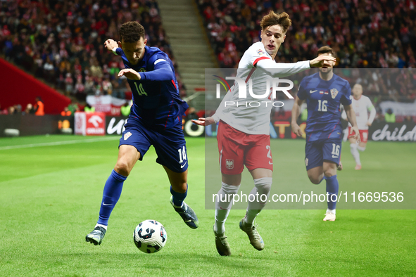 Ivan Perisic of Croatia and Nicola Zalewski of Poland during UEFA Nations League football match Poland - Croatia at National Stadium in Wars...