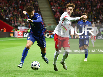 Ivan Perisic of Croatia and Nicola Zalewski of Poland during UEFA Nations League football match Poland - Croatia at National Stadium in Wars...