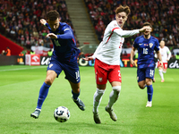 Ivan Perisic of Croatia and Nicola Zalewski of Poland during UEFA Nations League football match Poland - Croatia at National Stadium in Wars...