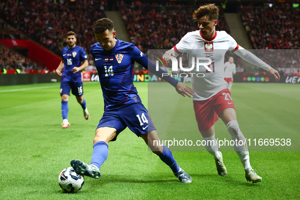 Ivan Perisic of Croatia and Nicola Zalewski of Poland during UEFA Nations League football match Poland - Croatia at National Stadium in Wars...