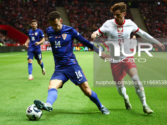 Ivan Perisic of Croatia and Nicola Zalewski of Poland during UEFA Nations League football match Poland - Croatia at National Stadium in Wars...