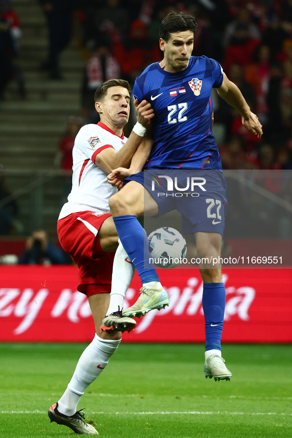 Jan Bednarek of Poland and Igor Metanovic of Croatia during UEFA Nations League football match Poland - Croatia at National Stadium in Warsa...