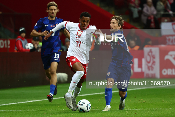 Michael Ameyaw of Poland and Luka Modric of Croatia during UEFA Nations League football match Poland - Croatia at National Stadium in Warsaw...