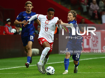 Michael Ameyaw of Poland and Luka Modric of Croatia during UEFA Nations League football match Poland - Croatia at National Stadium in Warsaw...