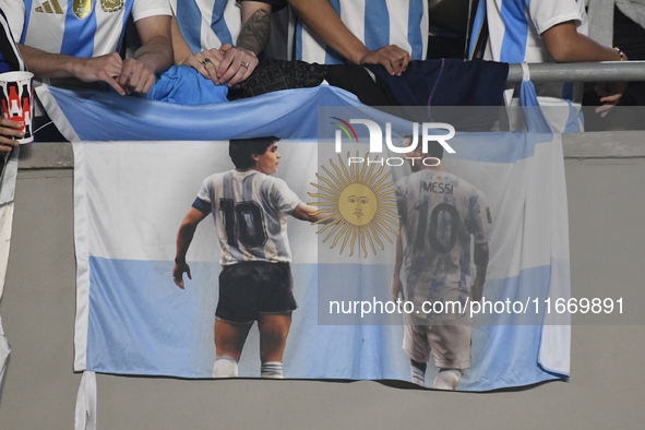 The flag of Diego Maradona and Lionel Messi of Argentina is displayed during a match between Argentina and Bolivia at Estadio Mas Monumental...