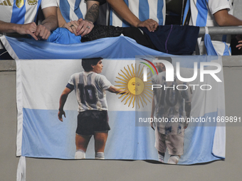 The flag of Diego Maradona and Lionel Messi of Argentina is displayed during a match between Argentina and Bolivia at Estadio Mas Monumental...