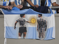 The flag of Diego Maradona and Lionel Messi of Argentina is displayed during a match between Argentina and Bolivia at Estadio Mas Monumental...