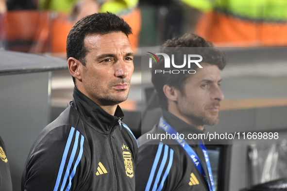 Lionel Scaloni and Pablo Aimar, coaches of Argentina, stand during the national anthems ceremony before a match between Argentina and Bolivi...