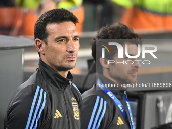 Lionel Scaloni and Pablo Aimar, coaches of Argentina, stand during the national anthems ceremony before a match between Argentina and Bolivi...