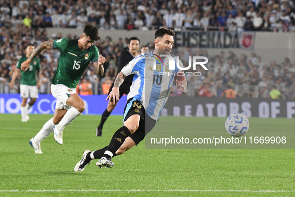 Lionel Messi of Argentina scores his first goal of the night during a match between Argentina and Bolivia at Estadio Mas Monumental Antonio...