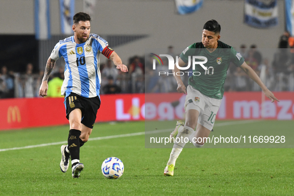 Lionel Messi of Argentina and Ramiro Vaca of Bolivia play during a match between Argentina and Bolivia at Estadio Mas Monumental Antonio Ves...