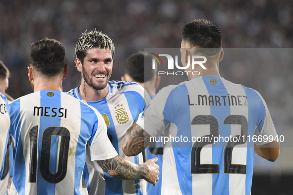 Lionel Messi, Rodrigo de Paul, and Lautaro Martinez celebrate their team's second goal during a match between Argentina and Bolivia at Estad...