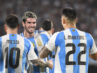 Lionel Messi, Rodrigo de Paul, and Lautaro Martinez celebrate their team's second goal during a match between Argentina and Bolivia at Estad...