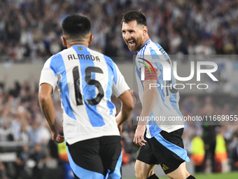 Lionel Messi celebrates his second goal of the night with Thiago Almada during a match between Argentina and Bolivia at Estadio Mas Monument...