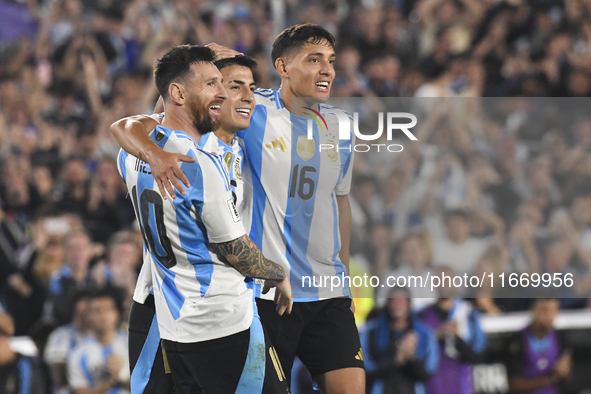 Lionel Messi celebrates his second goal of the night with Thiago Almada and Nahuel Molina during a match between Argentina and Bolivia at Es...