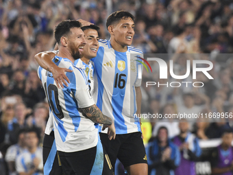 Lionel Messi celebrates his second goal of the night with Thiago Almada and Nahuel Molina during a match between Argentina and Bolivia at Es...