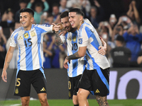 Lionel Messi of Argentina celebrates his third goal of the night with Thiago Almada and Enzo Fernandez during a match between Argentina and...