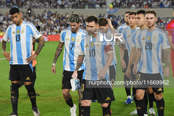 Cristian Romero, Lionel Messi, Alexis Mac Allister, Rodrigo De Paul, Julian Alvarez, Lautaro Martinez, and Nahuel Molina of Argentina stand...