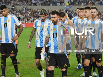 Cristian Romero, Lionel Messi, Alexis Mac Allister, Rodrigo De Paul, Julian Alvarez, Lautaro Martinez, and Nahuel Molina of Argentina stand...