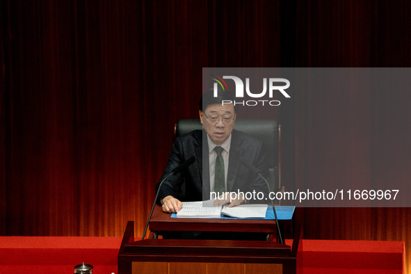 Hong Kong Chief Executive John Lee reads his 2024 Policy Address inside the Chambers of the Legislative Council in Hong Kong, China, on Octo...