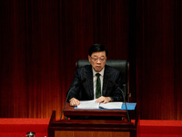 Hong Kong Chief Executive John Lee reads his 2024 Policy Address inside the Chambers of the Legislative Council in Hong Kong, China, on Octo...