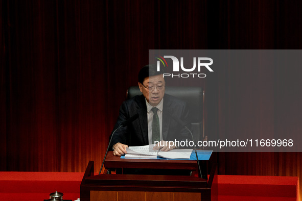 Hong Kong Chief Executive John Lee reads his 2024 Policy Address inside the Chambers of the Legislative Council in Hong Kong, China, on Octo...