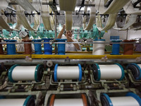 A worker works at a silk product production line of Anhui Jingjiu Silk Co in Fuyang, China, on October 16, 2024. (