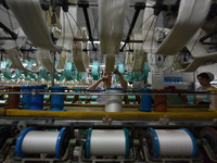 A worker works at a silk product production line of Anhui Jingjiu Silk Co in Fuyang, China, on October 16, 2024. (