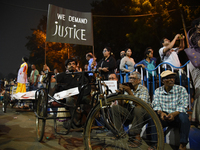 A financially challenged young boy holds a placard reading ''We Want Justice'' at the 'Droh Carnival', the human-chain protest demonstration...