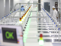 A worker produces an LED display at a workshop in Huai'an City, Jiangsu Province, China, on October 16, 2024. (