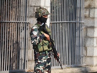 An Indian Paramilitary Soldier stands guard as Jammu and Kashmir and National Conference (NC) Vice President Omar Abdullah arrives to take t...