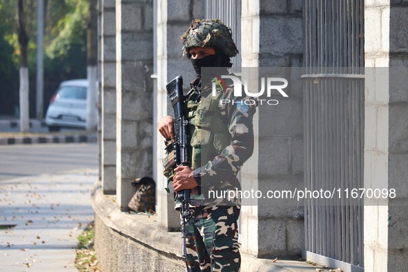 An Indian Paramilitary Soldier stands guard as Jammu and Kashmir and National Conference (NC) Vice President Omar Abdullah arrives to take t...