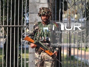 An Indian Paramilitary Soldier stands guard as Jammu and Kashmir and National Conference (NC) Vice President Omar Abdullah arrives to take t...