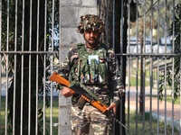 An Indian Paramilitary Soldier stands guard as Jammu and Kashmir and National Conference (NC) Vice President Omar Abdullah arrives to take t...