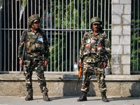 Indian paramilitary soldiers stand guard as Jammu and Kashmir and National Conference (NC) Vice President Omar Abdullah arrives to take the...