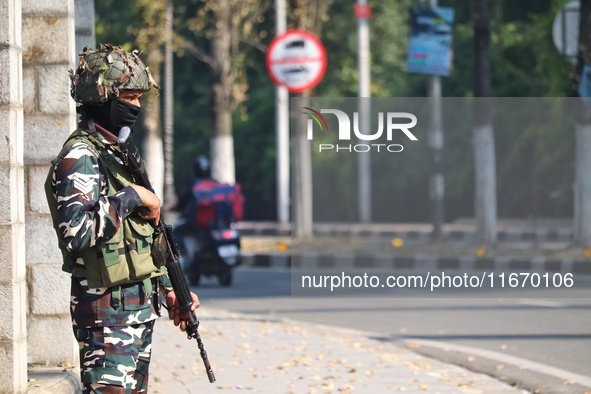 An Indian Paramilitary Soldier stands guard as Jammu and Kashmir and National Conference (NC) Vice President Omar Abdullah arrives to take t...