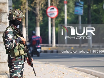 An Indian Paramilitary Soldier stands guard as Jammu and Kashmir and National Conference (NC) Vice President Omar Abdullah arrives to take t...