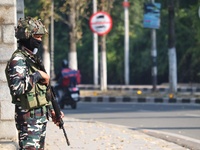 An Indian Paramilitary Soldier stands guard as Jammu and Kashmir and National Conference (NC) Vice President Omar Abdullah arrives to take t...