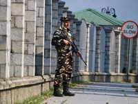 An Indian Paramilitary Soldier stands guard as Jammu and Kashmir and National Conference (NC) Vice President Omar Abdullah arrives to take t...