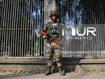 An Indian Paramilitary Soldier stands guard as Jammu and Kashmir and National Conference (NC) Vice President Omar Abdullah arrives to take t...