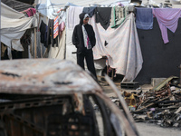 Palestinian displaced people are present at the site of an Israeli airstrike on the tents of the displaced inside the Al-Aqsa Martyrs Hospit...