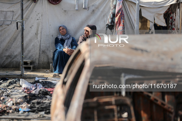 Palestinian displaced people are present at the site of an Israeli airstrike on the tents of the displaced inside the Al-Aqsa Martyrs Hospit...