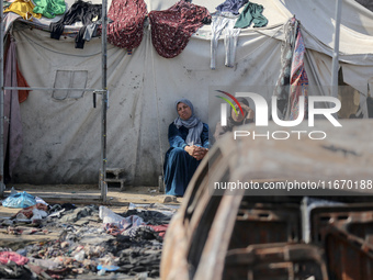 Palestinian displaced people are present at the site of an Israeli airstrike on the tents of the displaced inside the Al-Aqsa Martyrs Hospit...